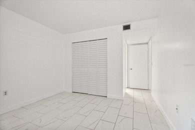 Welcome to this freshly painted, move-in-ready first-floor condo - photo 7
