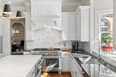 Experience the pinnacle of refined living in this meticulously - photo 16