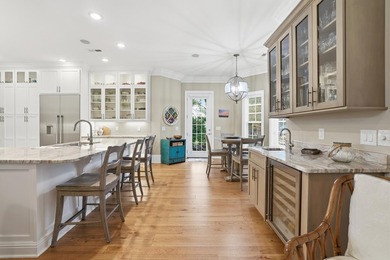 Set on the 11th fairway of The Reserve, 681 Reserve Drive is an - photo 16
