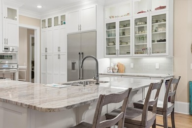 Set on the 11th fairway of The Reserve, 681 Reserve Drive is an - photo 19