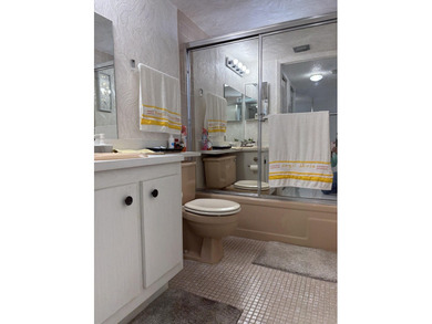 Bright and Stunning Corner unit with lake & Golf views, located