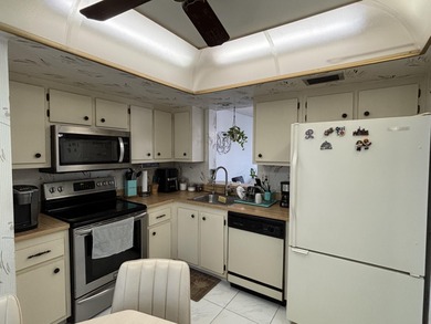 Bright and Stunning Corner unit with lake & Golf views, located