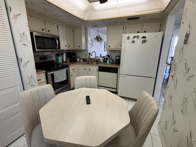 Bright and Stunning Corner unit with lake & Golf views, located