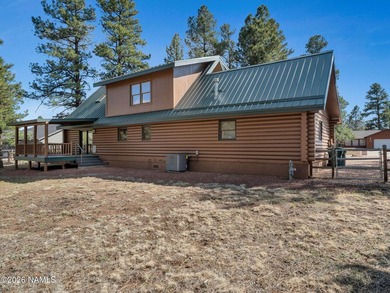 Welcome home to a rare true log cabin, perfectly situated across - photo 21