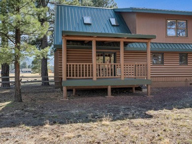 Welcome home to a rare true log cabin, perfectly situated across - photo 22