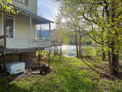 Welcome to 1449 State Route 30 in Wells, NY, a rare lakefront - photo 2