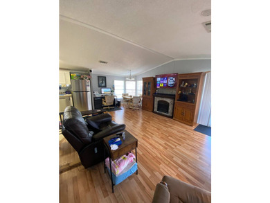 This home offers 2 bedrooms & 2 bathrooms on a quiet road with - photo 3