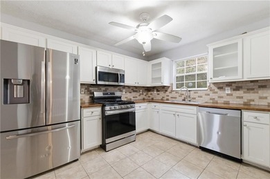 Welcome home to this beautifully designed 4-bedroom, 2.5-bath - photo 8