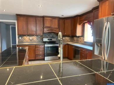 0.13 acre, fully chain link fenced 100x56 yard. 4 bedrooms, 2