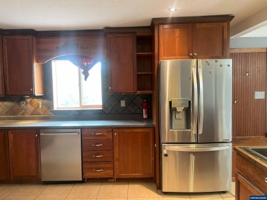 0.13 acre, fully chain link fenced 100x56 yard. 4 bedrooms, 2