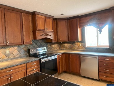 0.13 acre, fully chain link fenced 100x56 yard. 4 bedrooms, 2