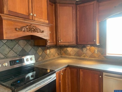 0.13 acre, fully chain link fenced 100x56 yard. 4 bedrooms, 2