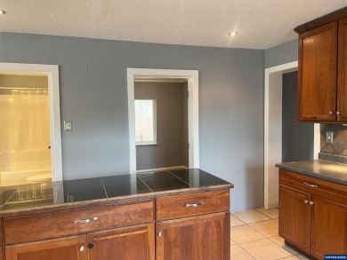 0.13 acre, fully chain link fenced 100x56 yard. 4 bedrooms, 2