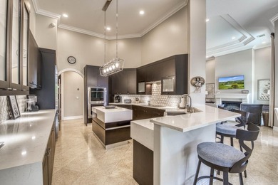Nestled within the exclusive gated community of Islands of - photo 9