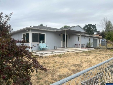 0.13 acre, fully chain link fenced 100x56 yard. 4 bedrooms, 2