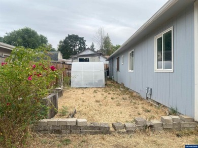 0.13 acre, fully chain link fenced 100x56 yard. 4 bedrooms, 2