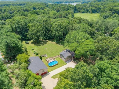 Nestled on over two acres in peaceful Grass Lake, this - photo 2