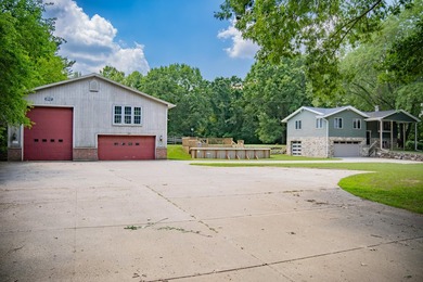 Nestled on over two acres in peaceful Grass Lake, this - photo 3