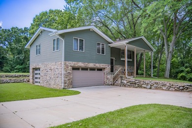 Nestled on over two acres in peaceful Grass Lake, this - photo 4