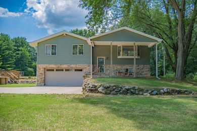 Nestled on over two acres in peaceful Grass Lake, this - photo 5