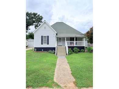 Welcome to 4 Front Street! Step inside this inviting 2-bedroom - photo 1