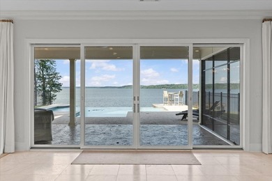 There are lake homes, and then there's this one. Sitting on a - photo 11
