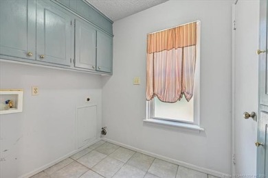 One-level full-brick home in Jenks Schools, featuring 4 bedrooms