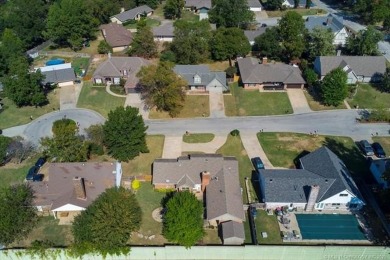 One-level full-brick home in Jenks Schools, featuring 4 bedrooms
