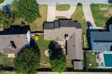 One-level full-brick home in Jenks Schools, featuring 4 bedrooms