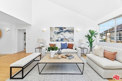 Welcome home to this rarely available top-floor condo offering