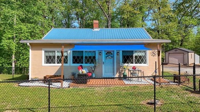 Set on a beautifully maintained 1.2 acre +/- lot, 195 Coast - photo 1