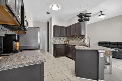NEW roof on this gorgeous updated 3BR/2BA/ 2 car garage, gated - photo 9