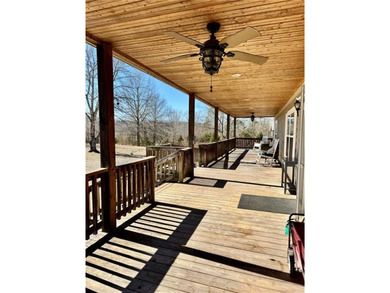 Well-maintained home on approximately 6 acres with a stocked