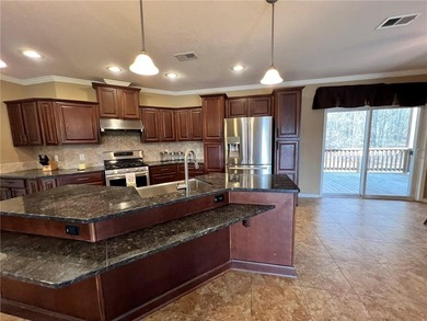 Well-maintained home on approximately 6 acres with a stocked