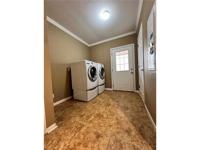 Well-maintained home on approximately 6 acres with a stocked