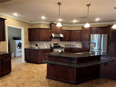 Well-maintained home on approximately 6 acres with a stocked