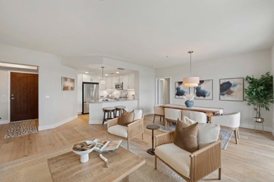 Stunning third-floor condo with serene hill views, flooding the