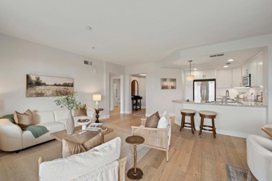 Stunning third-floor condo with serene hill views, flooding the