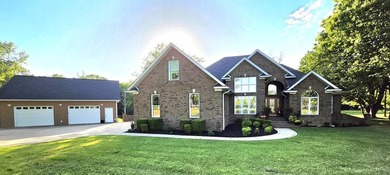 Custom-built brick home situated on 9.7 acres, located less than - photo 1
