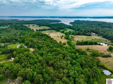 This 7.182+/- acre tract in Marshall County, Kentucky offers an - photo 1