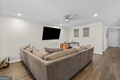 Welcome to this inviting end-unit townhome nestled in the highly - photo 12
