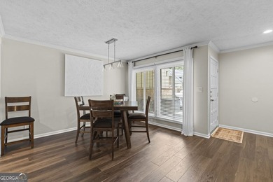 Welcome to this inviting end-unit townhome nestled in the highly - photo 14