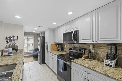 Welcome to this inviting end-unit townhome nestled in the highly - photo 20