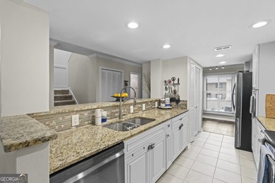 Welcome to this inviting end-unit townhome nestled in the highly - photo 21