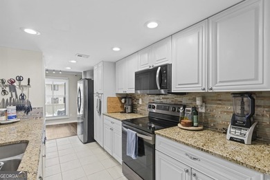 Welcome to this inviting end-unit townhome nestled in the highly - photo 22