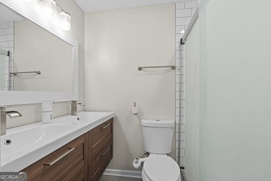 Welcome to this inviting end-unit townhome nestled in the highly - photo 32