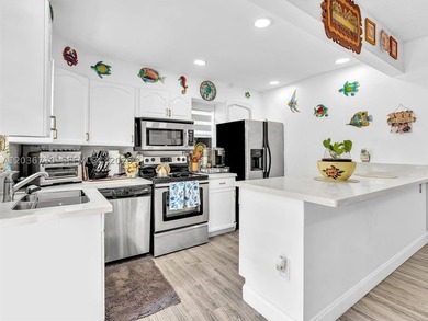 Welcome to this charming 2-bedroom, 1.5-bath townhouse located - photo 1