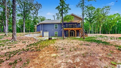 Tucked into a wooded setting just minutes from Kentucky Lake and - photo 2