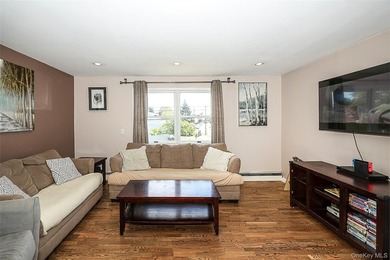 Welcome home to this spacious 6-bedroom, 2-bath Colonial nestled - photo 13