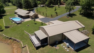 Custom steel-frame home with guest quarters, shop, pool, pond & - photo 34